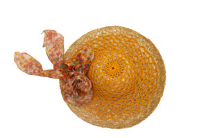 A woven hat with an orange crocheted cover and ribbon.
