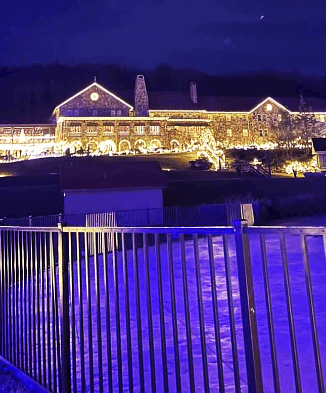 exterior picture of Mountain Lake Lodge with holiday lights